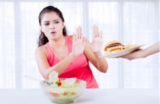 Girl using the Be Do Have coaching model to BEcome someone who can say no to junk food. Girl being someone who can say no to junk food