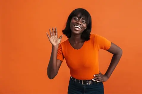 Vibrant and exciting life coach surrounded with orange