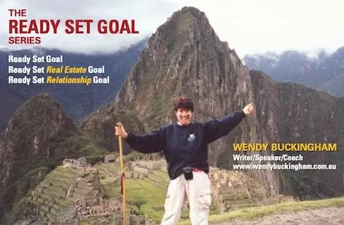 Business card idea for a life coach featuring Wendy Buckingham standing at Machu Picchu with arms raised, promoting the "Ready Set Goal" series for personal, real estate, and relationship goals